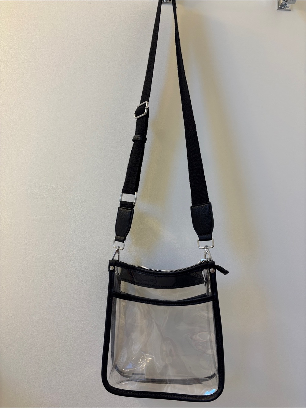 Concert Bag - Clear Crossbody Bag, with zipper and black strap.